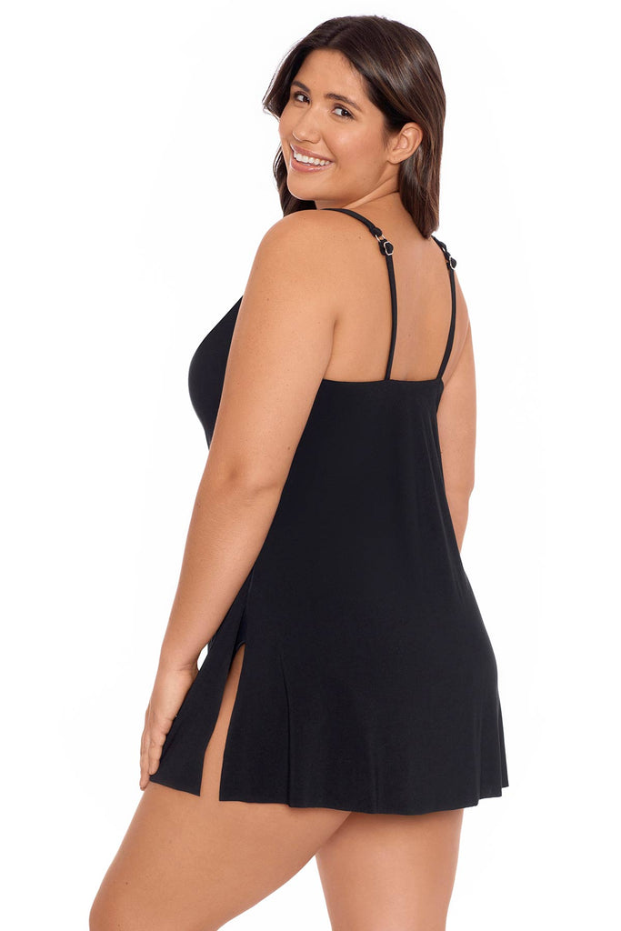 Woman wearing black swimdress with side slit and adjustable straps