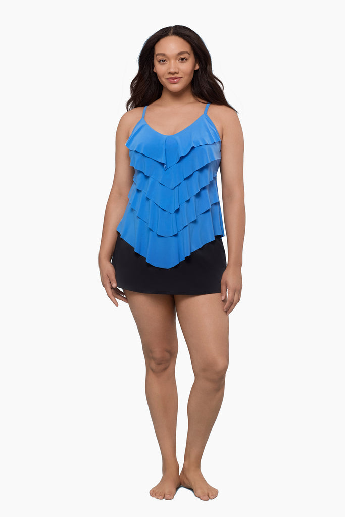Woman wearing a tiered tankini top in light blue