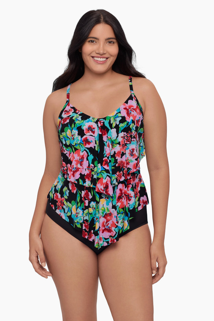 Woman wearing a tiered tankini top with a floral print
