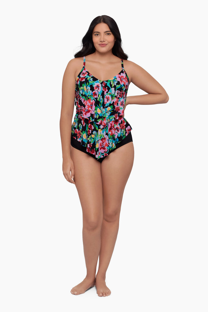 Woman wearing a tiered tankini top with a floral print
