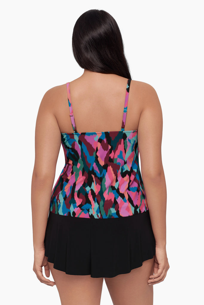 Woman turned away wearing a
tankini top with a collage patchwork print