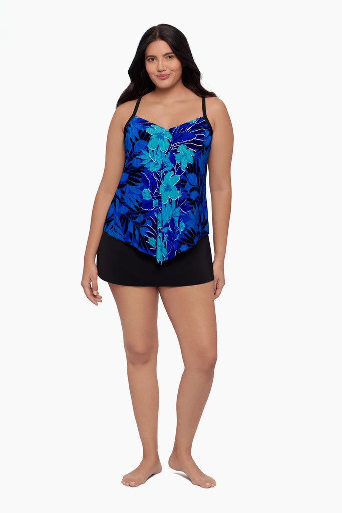 Woman wearing a tankini top with a blue floral pattern