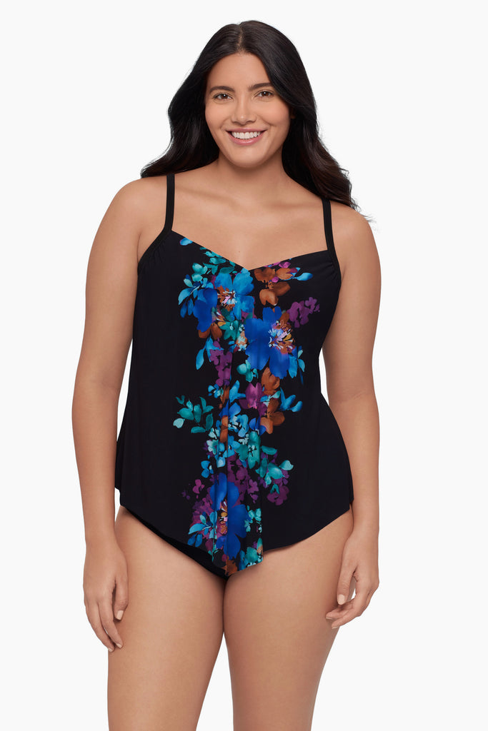Woman wearing a tankini top with a floral print down the middle
