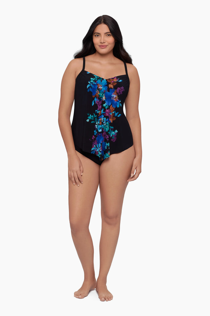 Woman wearing a tankini top with a floral print down the middle