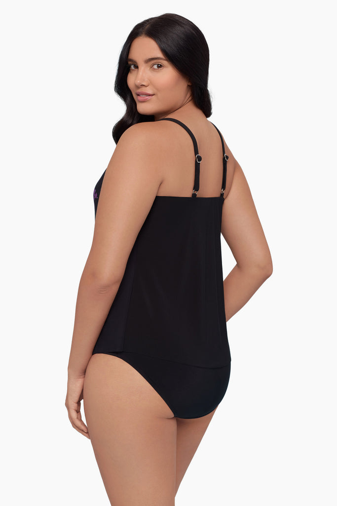 Woman turned left wearing a tankini top with a floral print down the middle