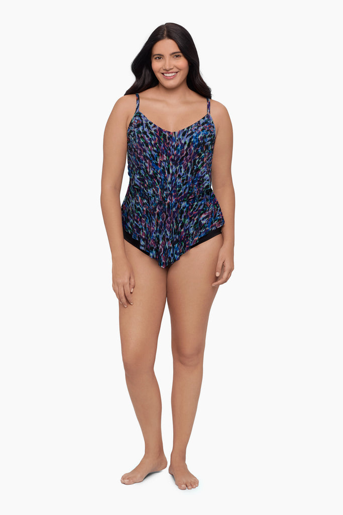 Woman wearing a blue abstract tankini top with ruffles