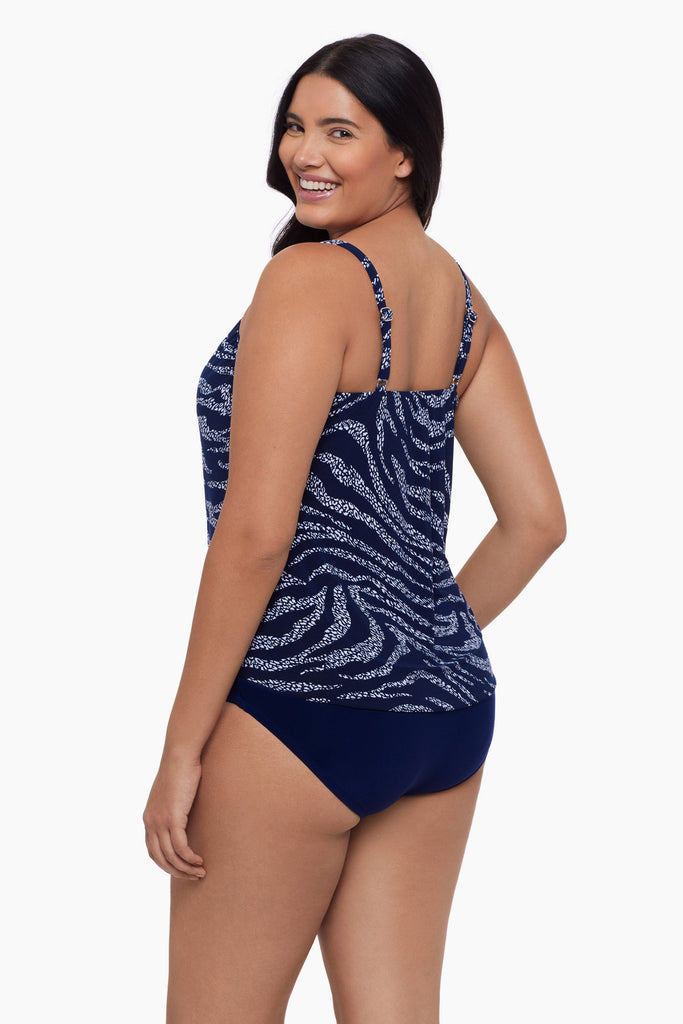 Woman turned left wearing a tankini top with a blue and white print