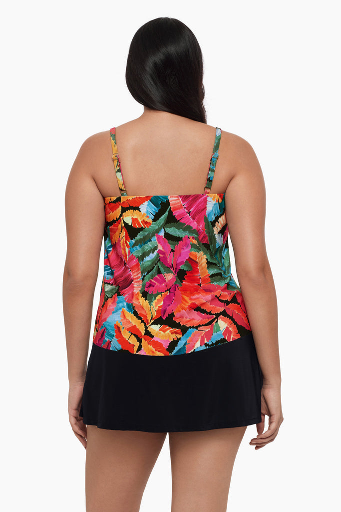 Woman turned away wearing a tankini top with a multicolored floral print