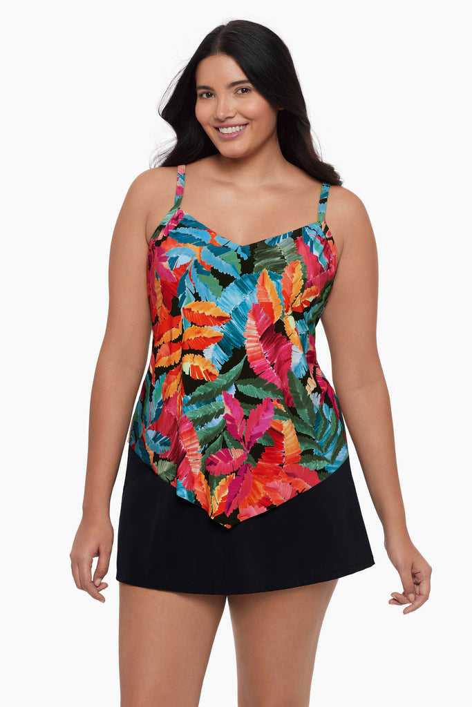 Woman wearing a tankini top with a multicolored floral print