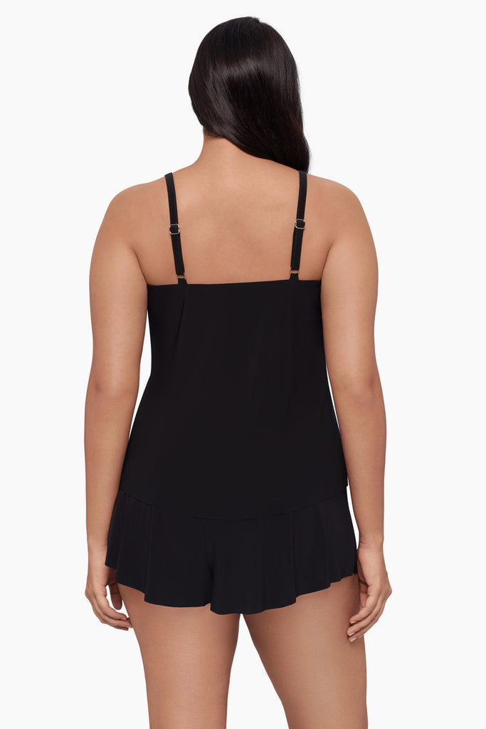 Woman turned away wearing a tankini top with an ombre leopard print