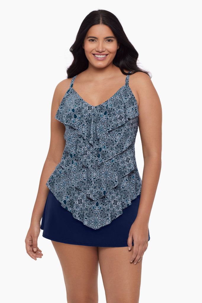 Woman wearing a tiered tankini top with a blue tile pattern