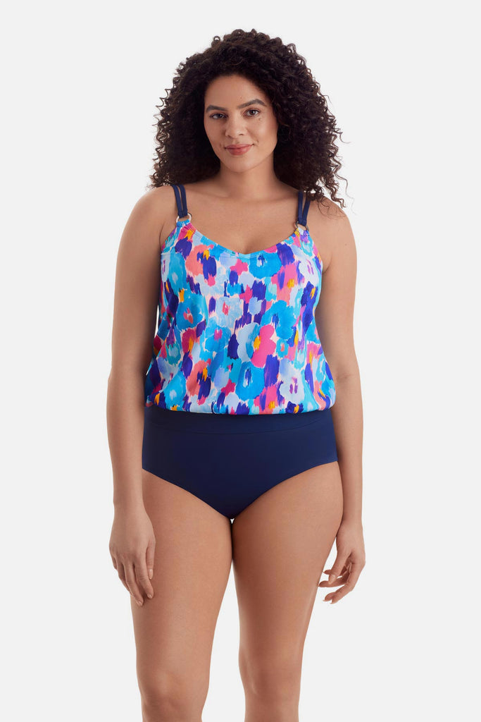 Woman wearing a multicolor abstract print blouson tankini top