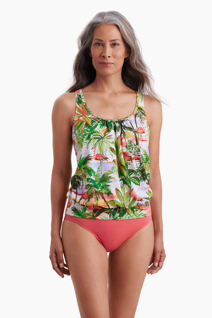 Woman wearing a blouson tankini top with a tropical flamingo print
