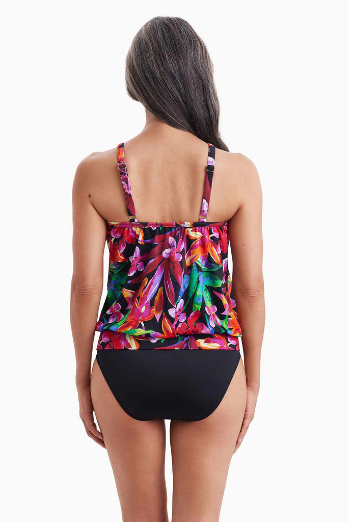 Woman faced away wearing blouson style tankini top with multicolor floral print