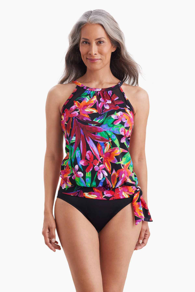 Woman wearing blouson style tankini top with multicolor floral print