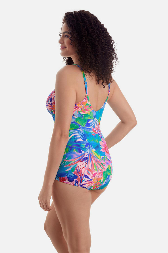 Woman wearing a multicolored floral print sarong one-piece swimsuit