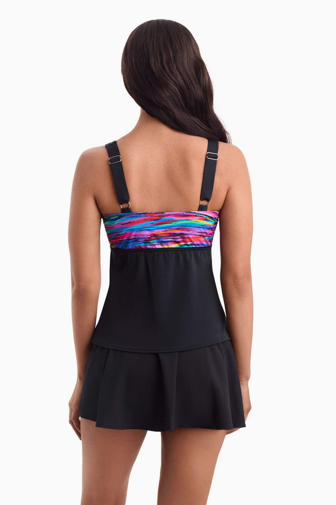 Woman facing away to show off multicolored strip on the back
