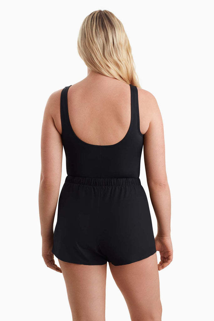 Woman turned away to show back detail of swimsuit