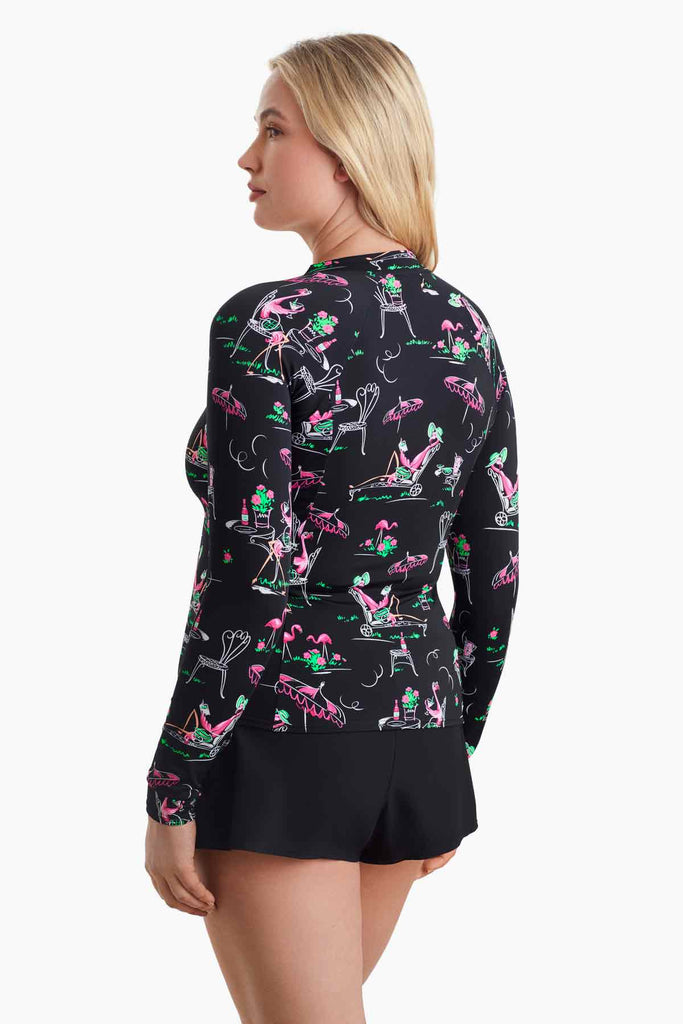 Woman turned to the side to show detail of sun shirt