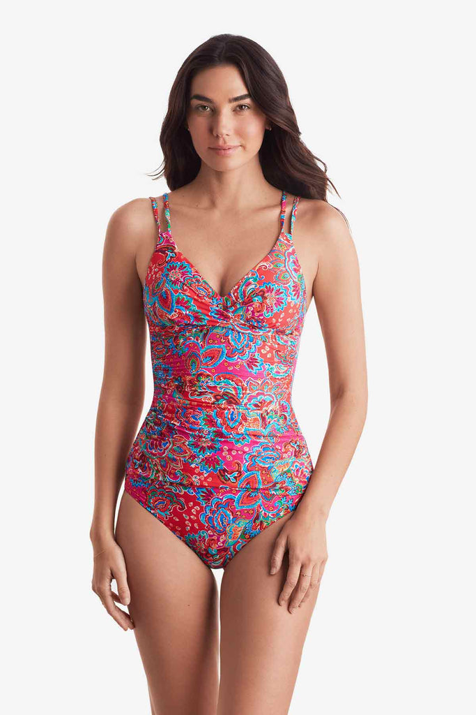 Woman wearing a multicolor paisley print tankini top with matching swim bottoms