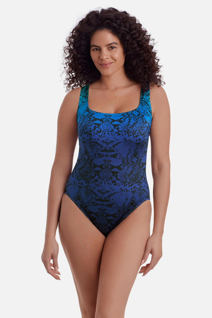 Woman wearing an animal-esque print one-piece swimsuit in blue