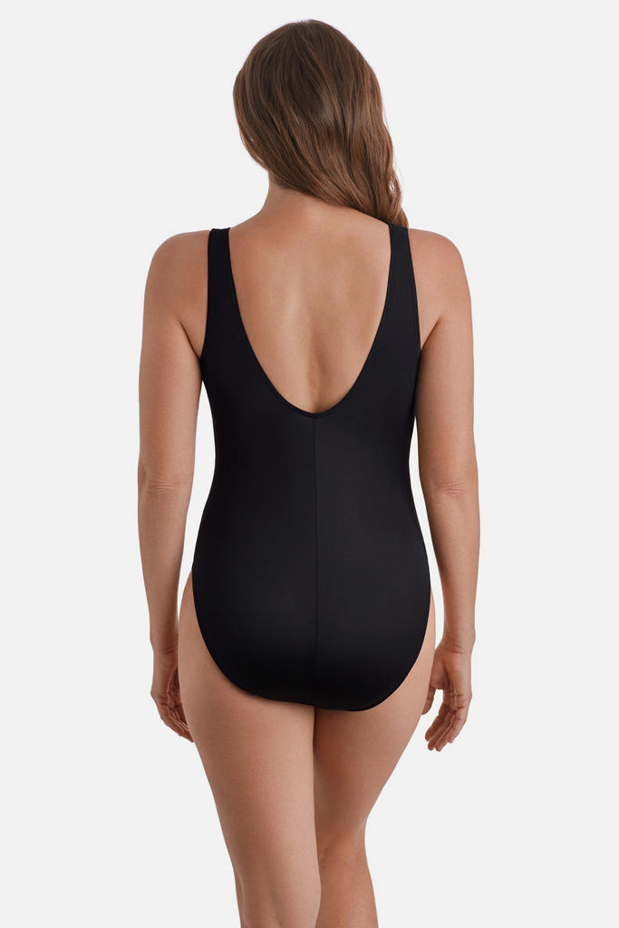 Woman wearing a one-piece swimsuit with a scoop back