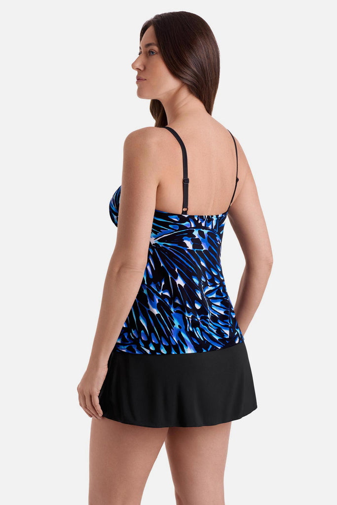 Woman turned left wearing a blue abstract printed faux ruffle skirtini swimsuit