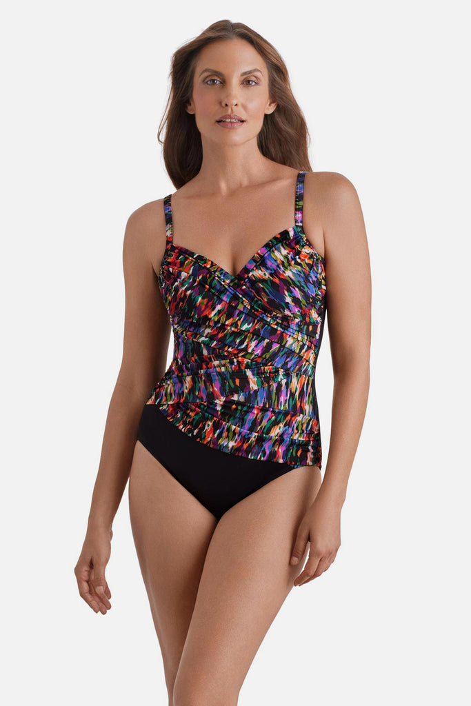 Woman wearing a multicolored abstract printed wrap one-piece swimsuit