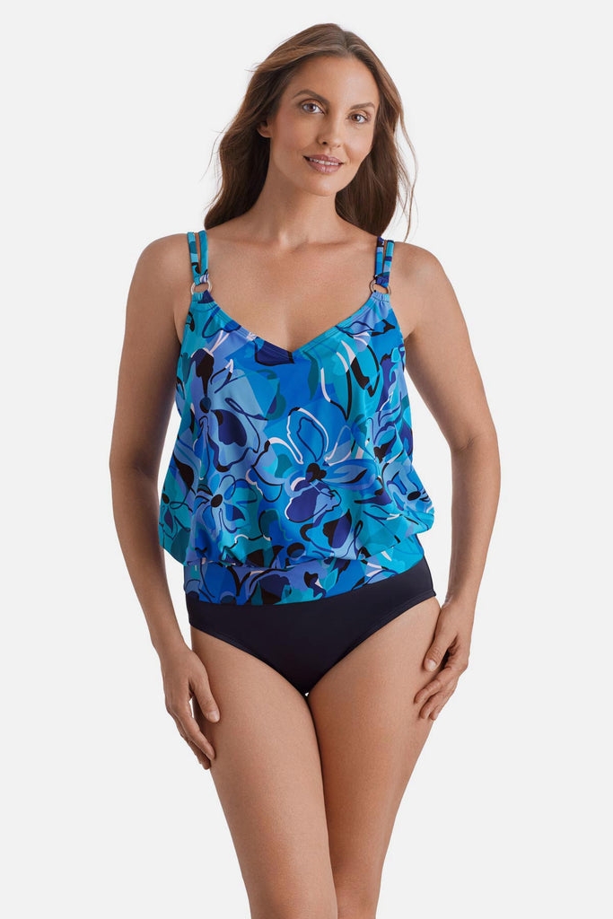 Woman wearing a blue floral printed one-piece blouson swimsuit