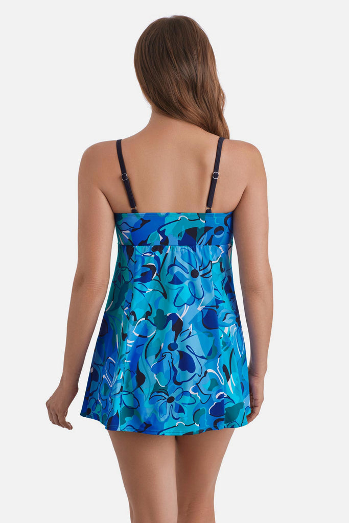 Woman faced away wearing a blue floral printed swim dress 