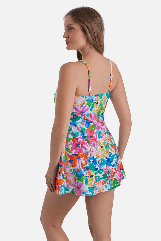 Woman turned left wearing a multicolored floral print square neck swim dress
