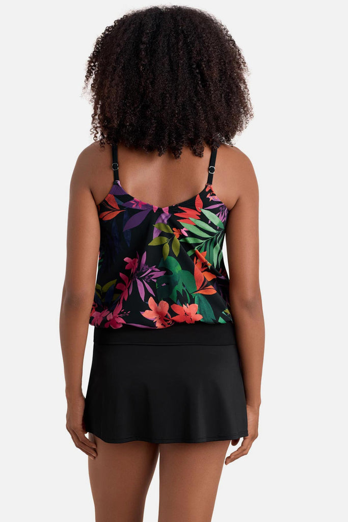Woman turned away wearing a multicolored floral printed blouson tankini top
