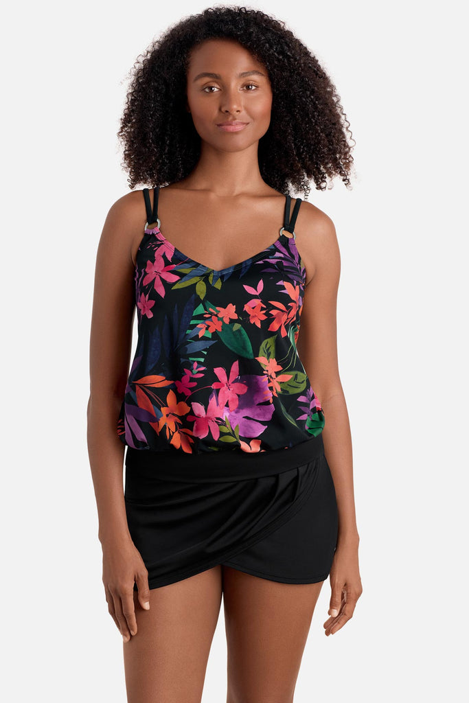 Woman wearing a multicolored floral printed blouson tankini top