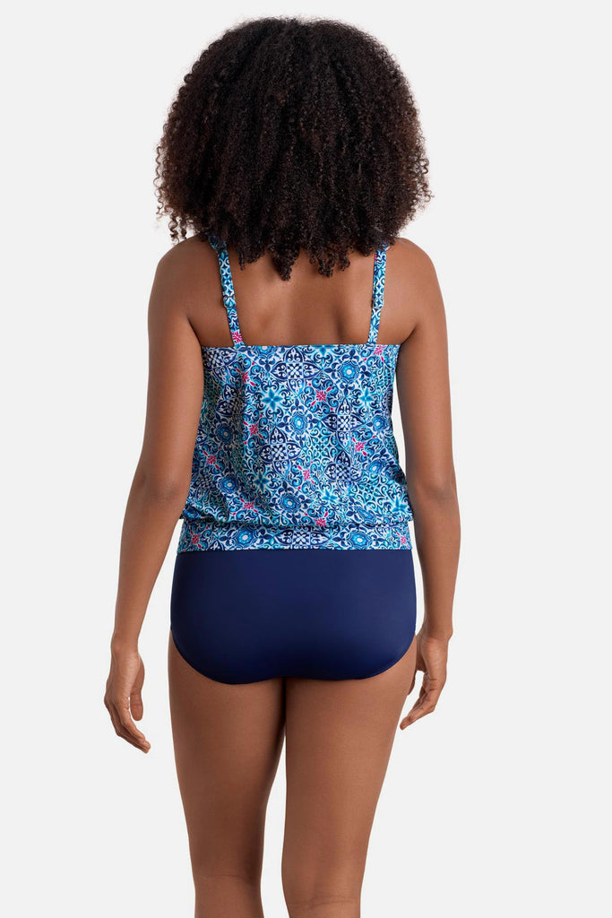 Woman turned away wearing a blue tile print shirred neck blouson tankini top