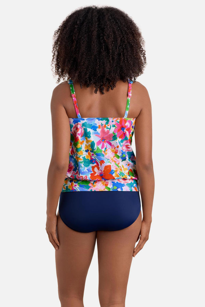 Woman turned away wearing a multicolored floral print blouson tankini top