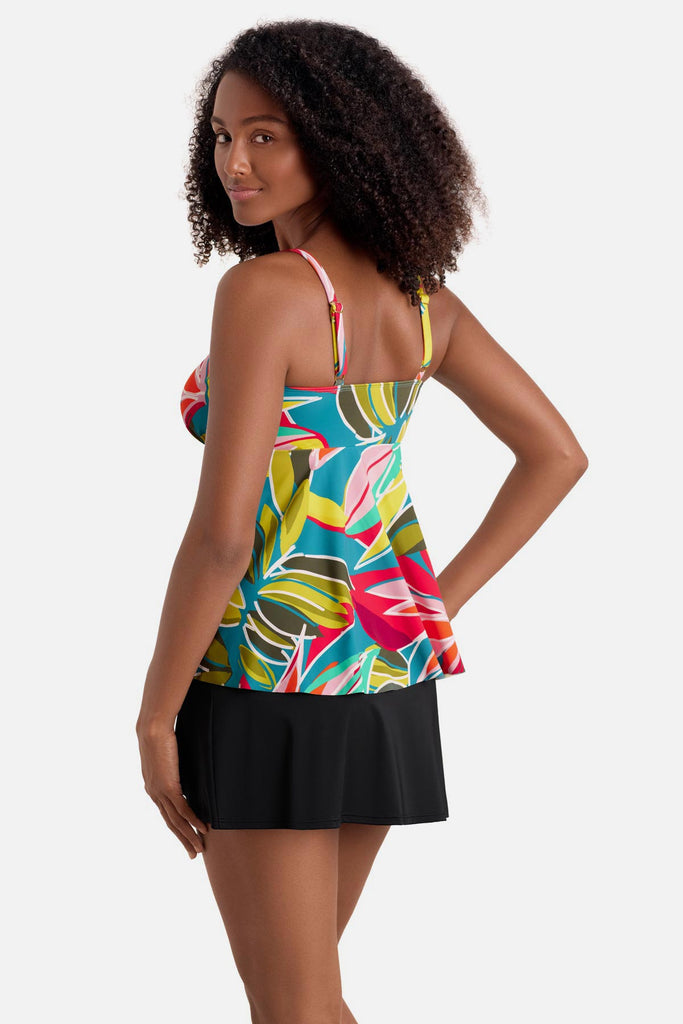 Woman turned left wearing a multicolored abstract printed tankini top