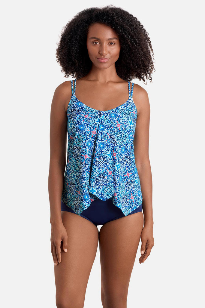 Woman wearing a blue tile print handkerchief tankini top