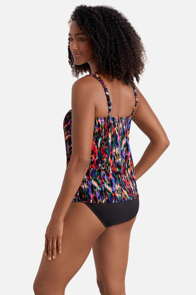 Woman turned left wearing a multicolored abstract printed handkerchief tankini top