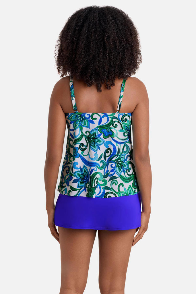 Woman turned away wearing a blue and green floral printed tankini top