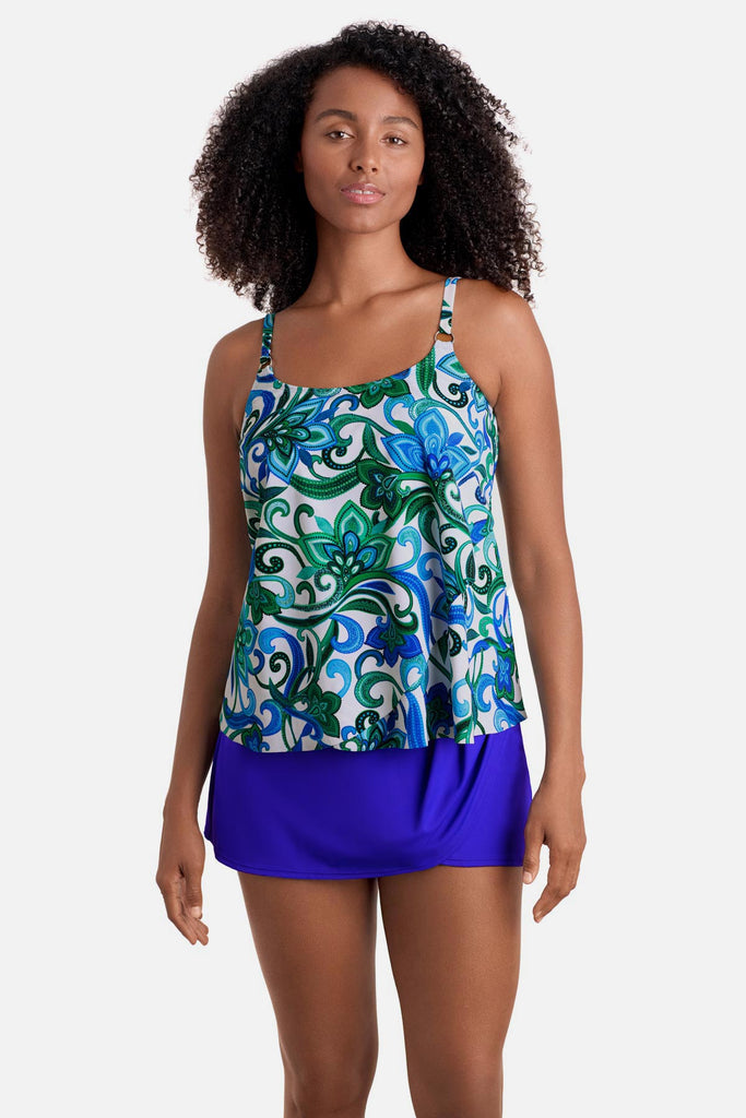 Woman wearing a blue and green floral printed tankini top